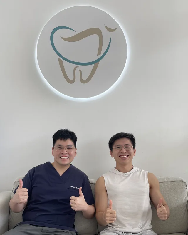 Ivory Dental dentists under the clinic's tooth logo
