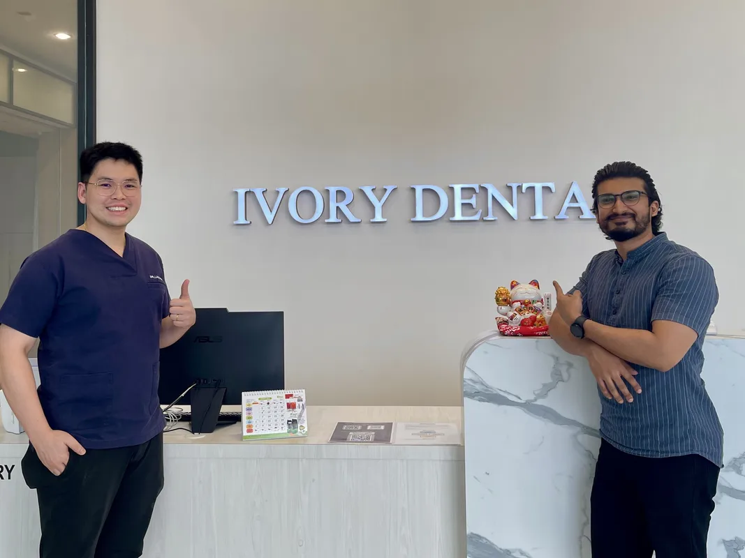 Ivory Dental team member with a patient at reception