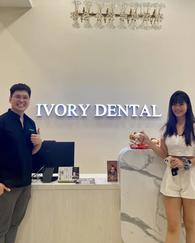 Ivory Dental team member with a patient at reception